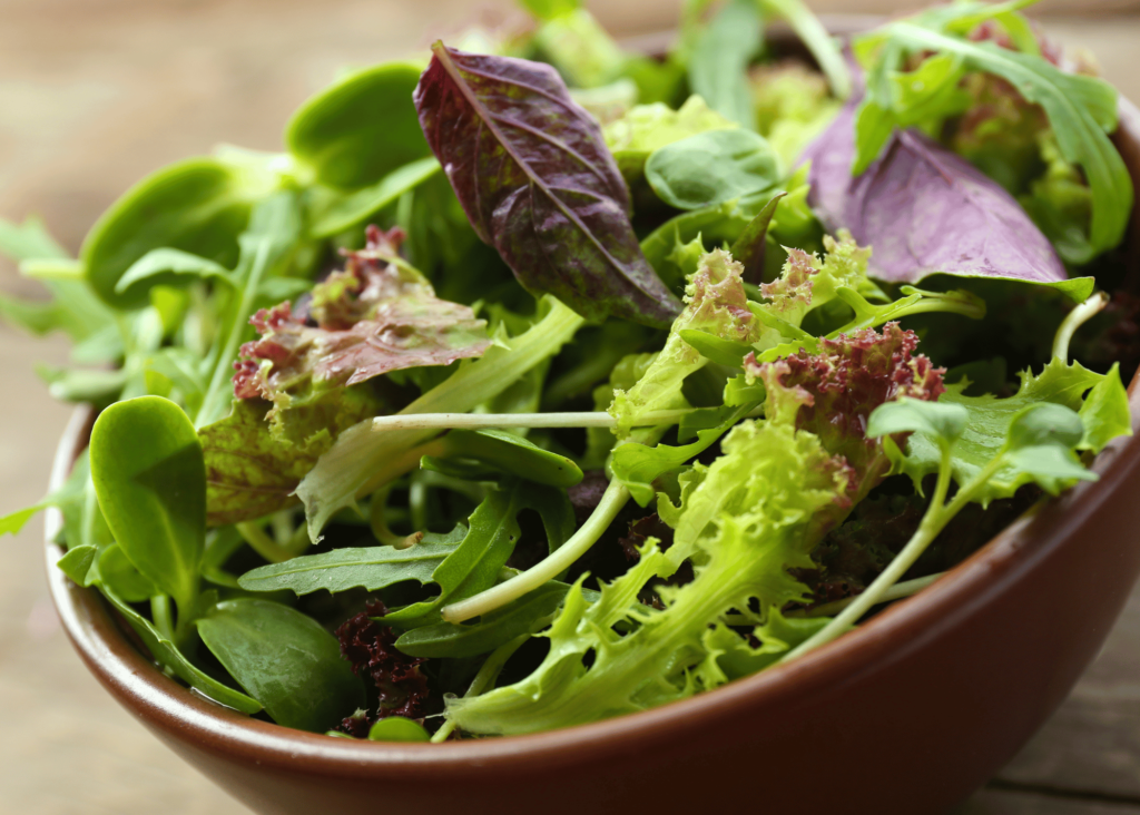 a fresh bowl of lettuce and spinach greens